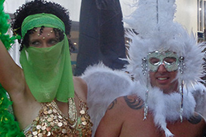 Woman in Green and Man in White Costume